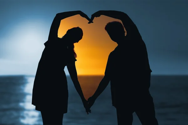 Sunset of a beautiful day against couple — Stock Photo, Image