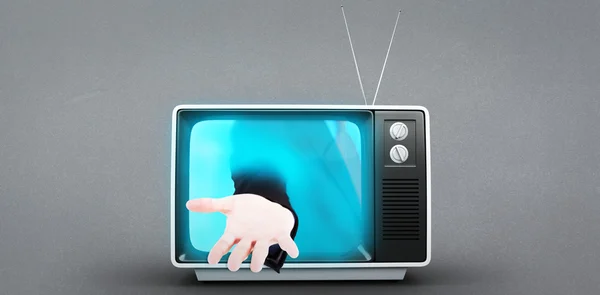 Zakenman die hand uit tv — Stockfoto