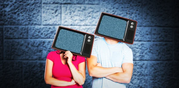 Couple with tv over heads — Stock Photo, Image