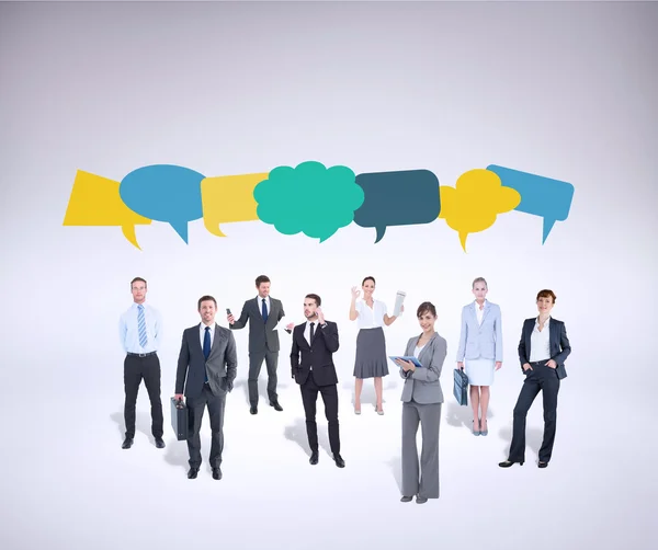 Business team against speech bubbles — Stock Photo, Image