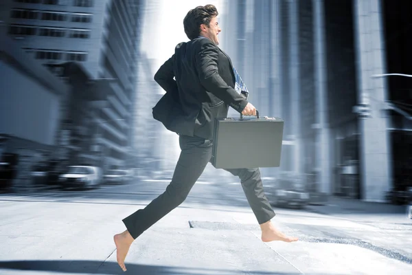 Businessman jumping against new york street — Stock Photo, Image