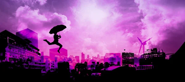 Woman jumping with umbrella — Stock Photo, Image