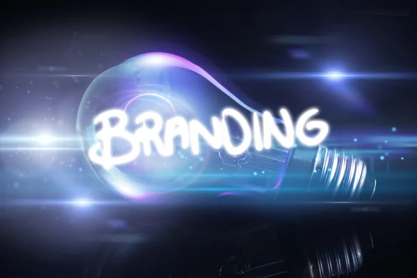 Branding against glowing light bulb — Stock Photo, Image