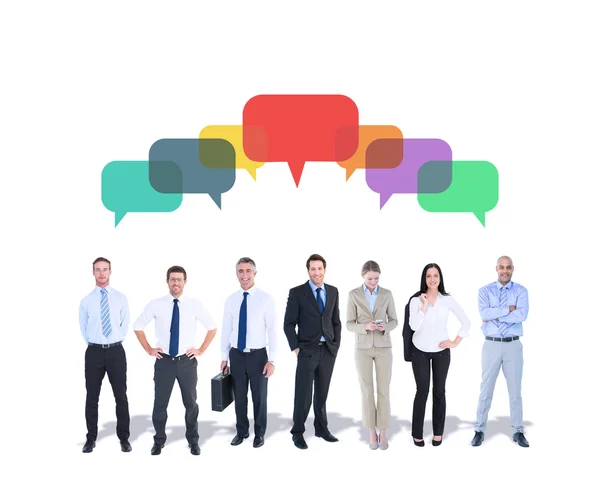 Business team against speech bubbles — Stock Photo, Image