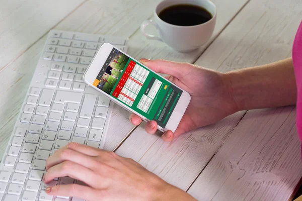 Woman using smartphone at work — Stock Photo, Image