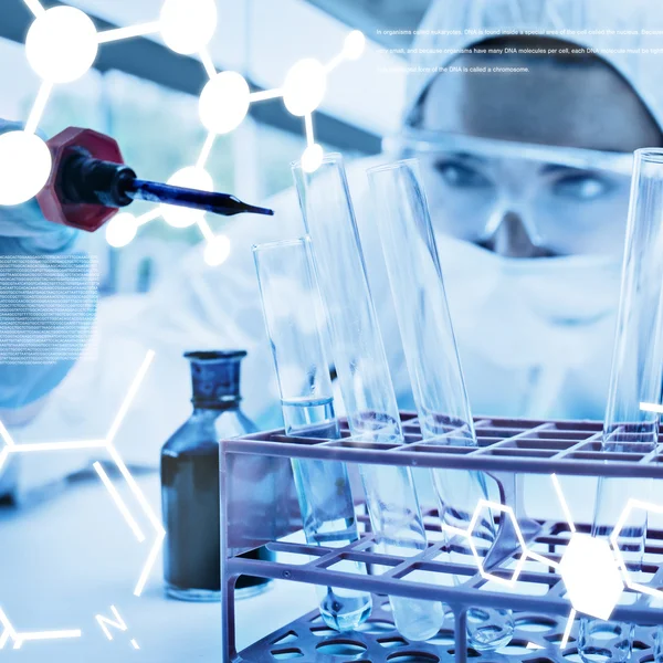 Scientist dropping liquid in test tube — Stock Photo, Image