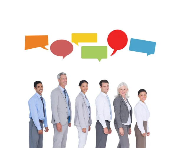 Business people against speech bubbles — Stock Photo, Image