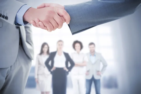 Composite image of business handshake Royalty Free Stock Photos