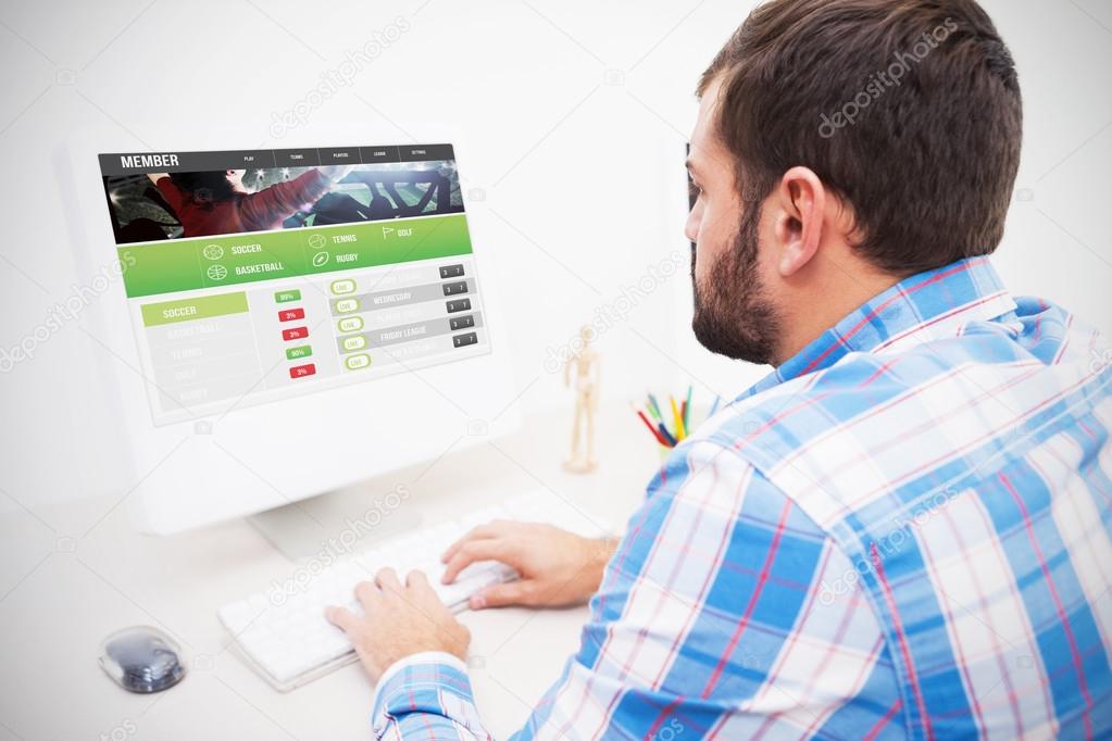 Composite image of gambling app screen against casual businessman working at his desk