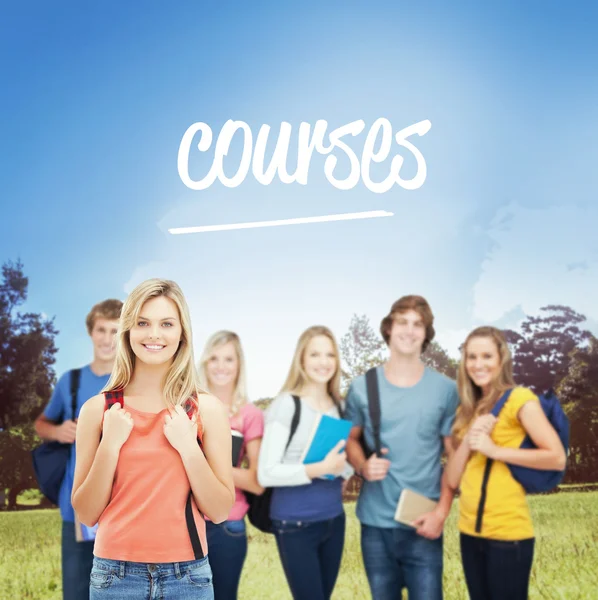 Girl stands in front of her college friends — Stock Photo, Image