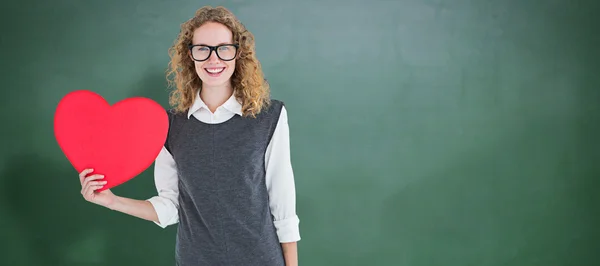 Geeky hipster holding heart card — Stock Photo, Image