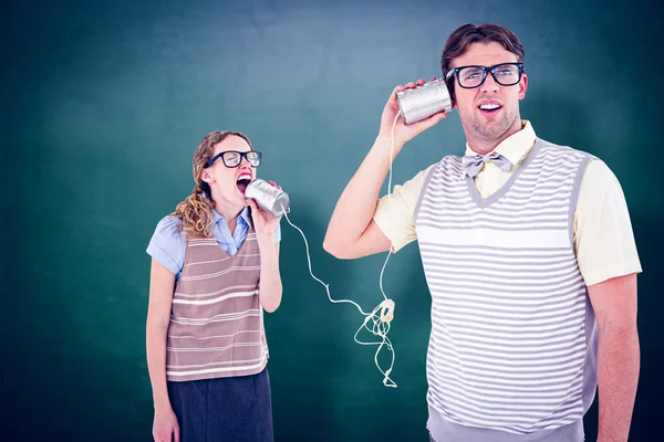 Couple speaking with tin can phone — Stock Photo, Image