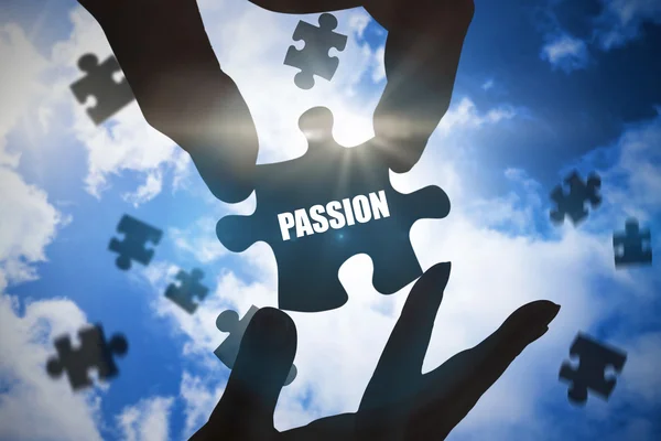 Word passion and hands holding jigsaw — Stock Photo, Image