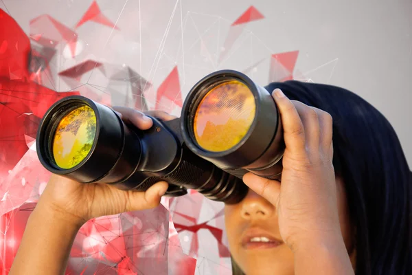 Girl looking through binoculars — Stock Photo, Image