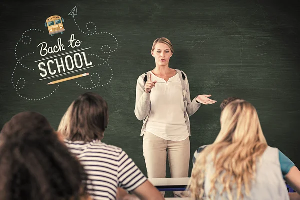 Teacher teaching students in class — Stock Photo, Image