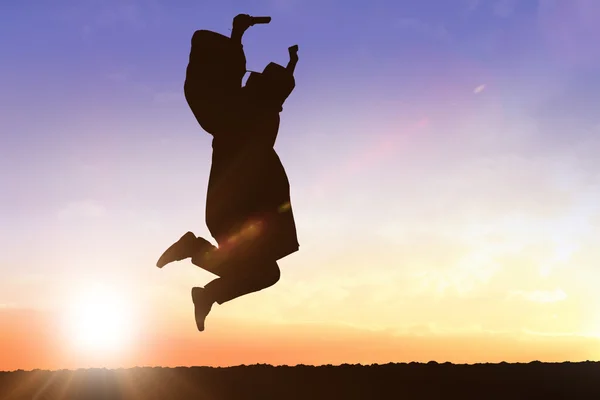 Imagem composta de silhueta de graduado — Fotografia de Stock