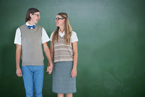 Geeky hipster couple holding hands — Stock Photo, Image