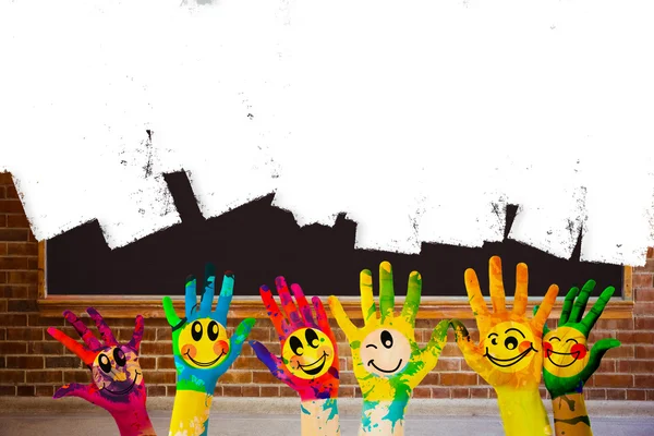 Hands with colourful smiley faces — Stock Photo, Image