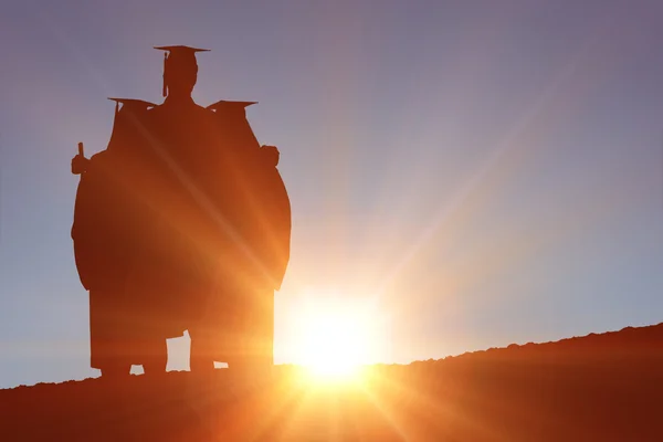 Imagem composta de silhueta de graduado — Fotografia de Stock