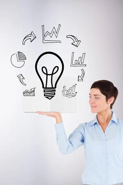 Businesswoman showing a book — Stock Photo, Image