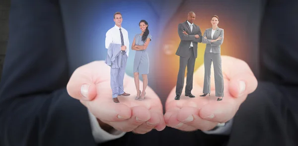 Businessmen and women with hands crossed — Stock Photo, Image