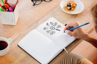 Man writing notes on diary clipart