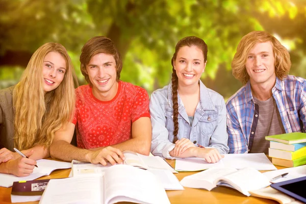 Students doing homework in library — Stock Photo, Image