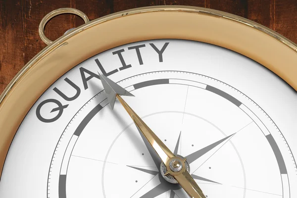 Composite image of compass pointing to quality — Stock Photo, Image