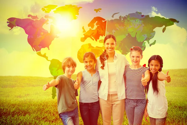 Cute pupils and teacher smiling — Stock Photo, Image