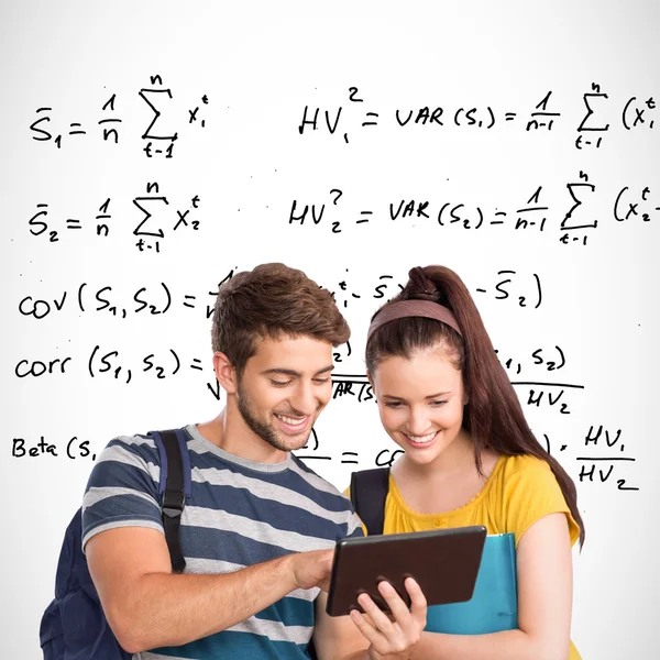 Happy students using tablet pc — Stock Photo, Image