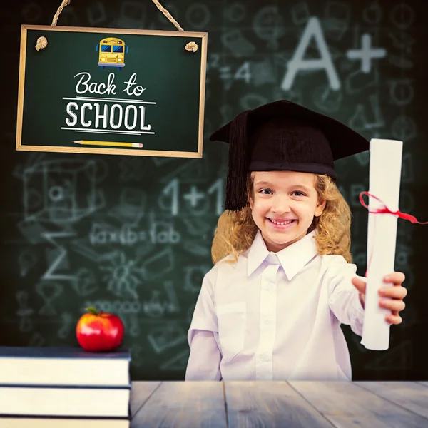 Schoolgirl holding doploma — Stock Photo, Image