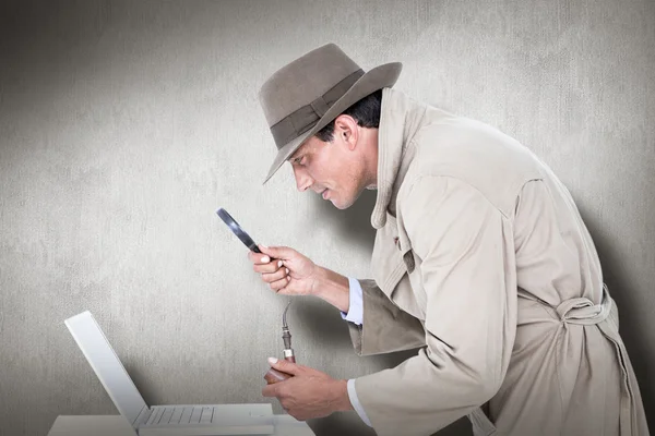 Spy looking through magnifier — Stock Photo, Image