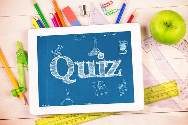 Quiz against students desk with tablet pc — Stock Photo, Image