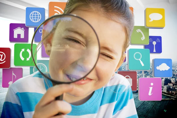 Girl looking through magnifying glass — Stock Photo, Image