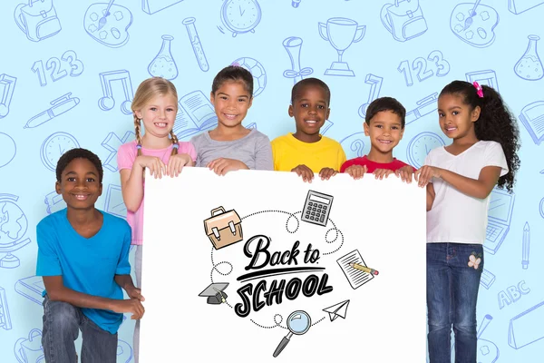 Elementary pupils showing card — Stock Photo, Image