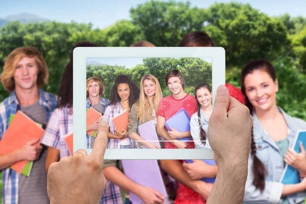 Composite image of hand holding tablet pc — Stock Photo, Image