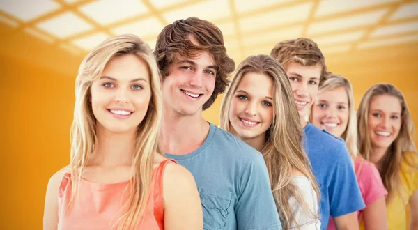 Smiling group standing behind each other — Stock Photo, Image