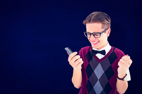 Excited geeky hipster texting on phone — Stock Photo, Image