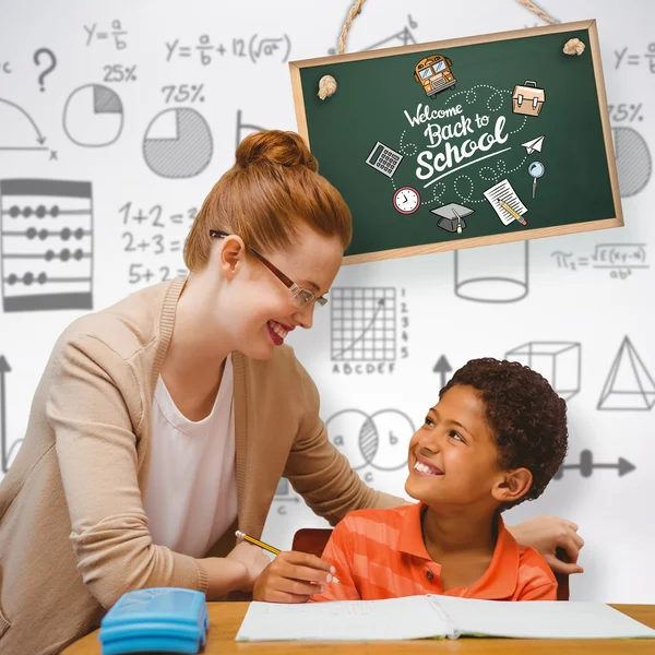 Teacher helping pupil — Stock Photo, Image