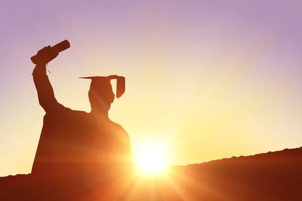 Composite image of silhouette of graduate — Stock Photo, Image