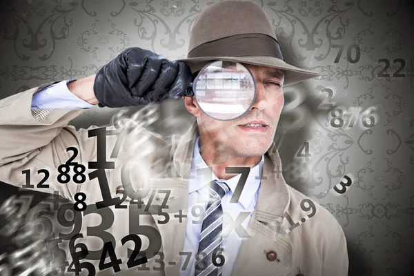 Spy looking through magnifier — Stock Photo, Image