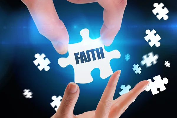 Word faith and hands holding jigsaw — Stock Photo, Image