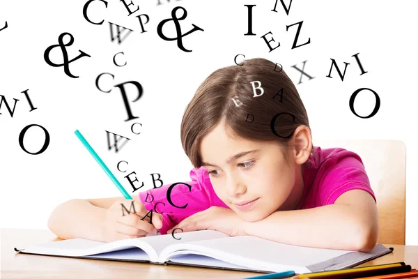 Netter Schüler am Schreibtisch — Stockfoto