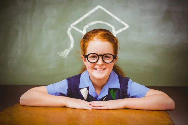 Little girl smiling in classroom — Stock Photo, Image