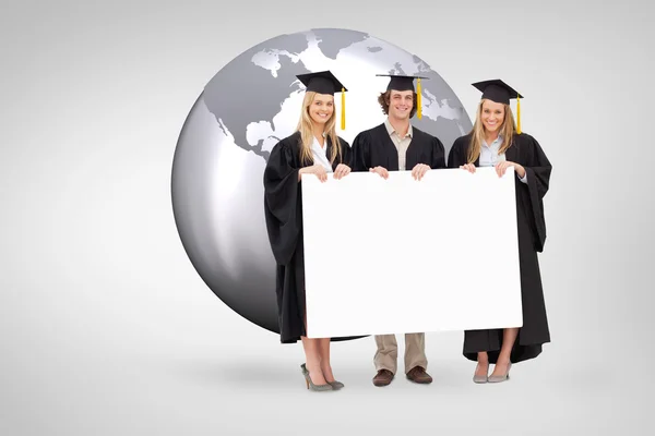 Three students in graduate robe — Stock Photo, Image