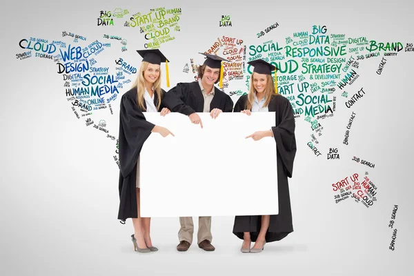 Three students in graduate robe — Stock Photo, Image