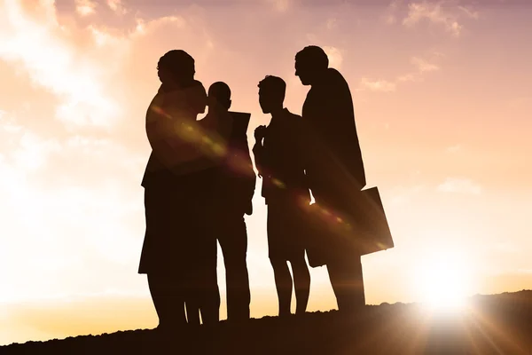 Silhouettes of people standing — Stock Photo, Image