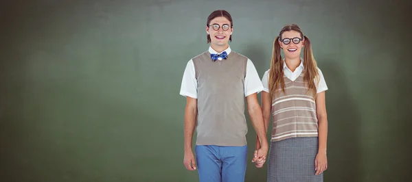 Geeky hipster couple holding hands — Stock Photo, Image