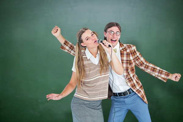 Hipsters singing with microphone — Stock Photo, Image