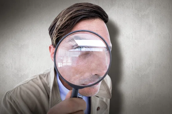 Spy looking through magnifier — Stock Photo, Image